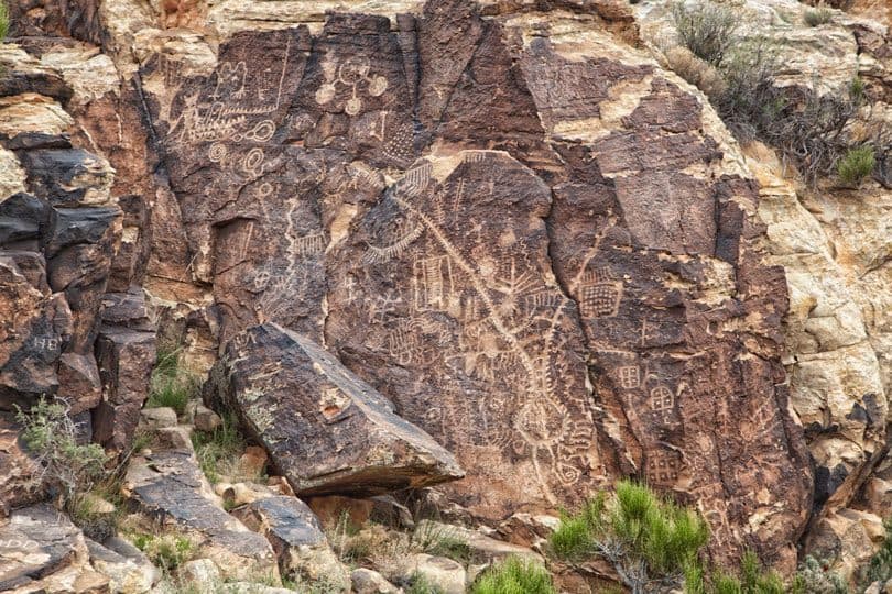 The different cultures are evident by the hundreds of petroglyphs carved into the Parowan Gap. T