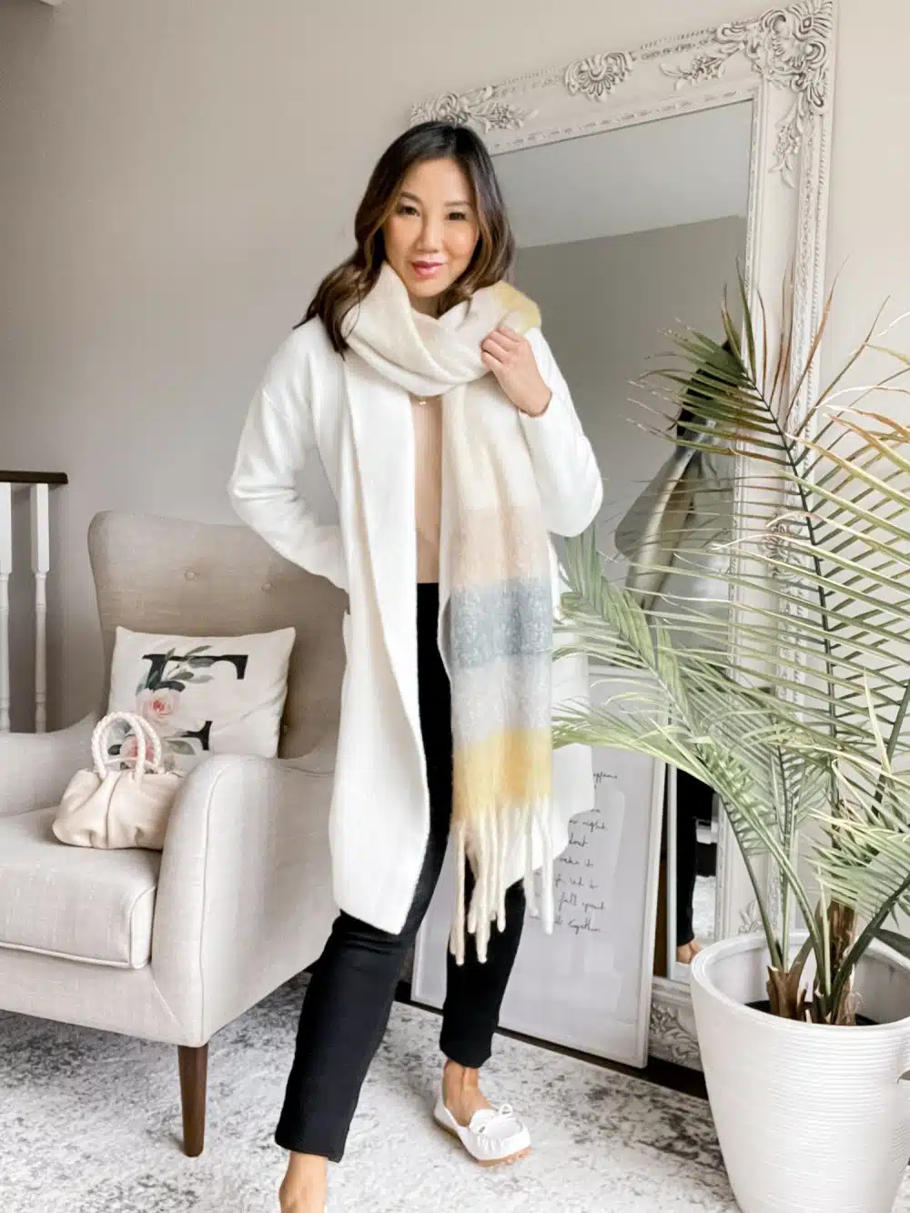 Time to get cozy! This coatigan is the perfect layering piece for fall and winter. Staying cozy in this casual fall outfit layered with a knit scarf and tan sweater. Styled by Eileen Lazazzera of yesmissy.com