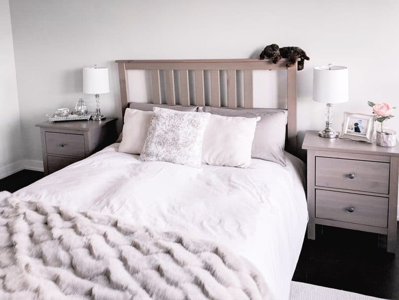 Cozy bedroom design with bedding from Skylark and Owl linen, pillows and fur throw