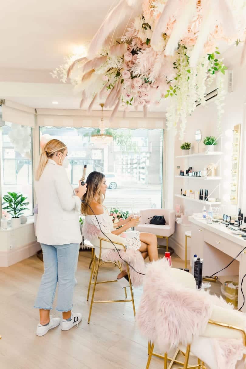 Getting makeup and hair done at the Fancy Face Rosé Room