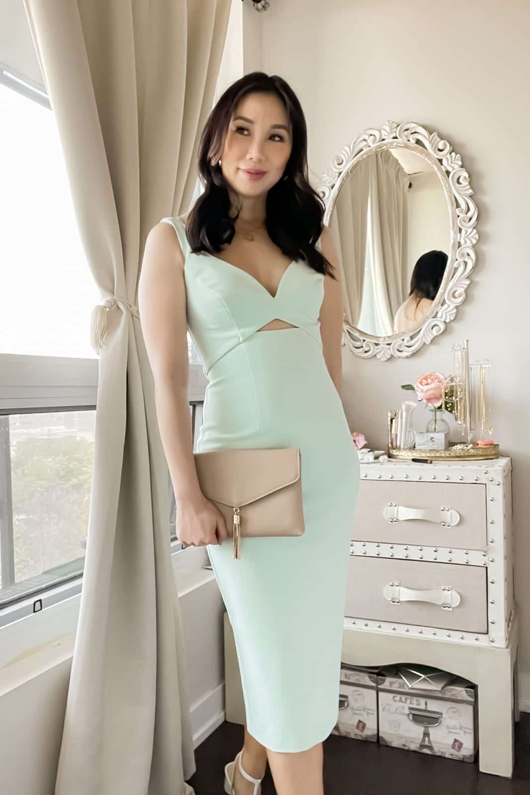 This sleek cocktail dress with cut out detail will have you looking like the best dressed guest at your next summer wedding. Check out more outfit ideas on yesmissy.com