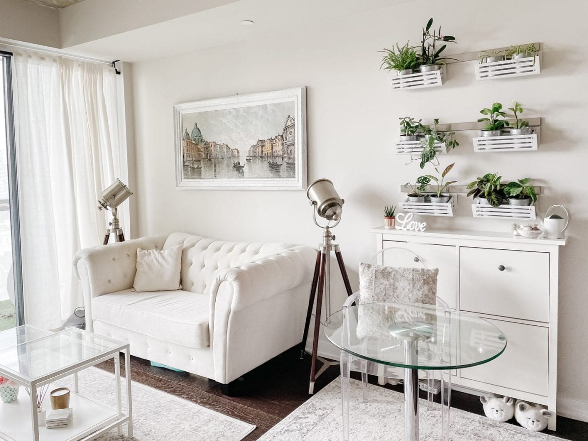 Condo living room - cottage chic style with sofa and plant wall in living room