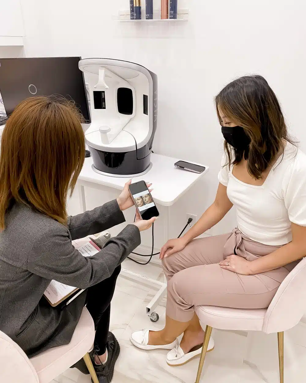 Thermage consultation at Rejuuv Medi Spa in Toronto. Looking at before and after pictures of Thermage for face, eyes, legs, stomach. 