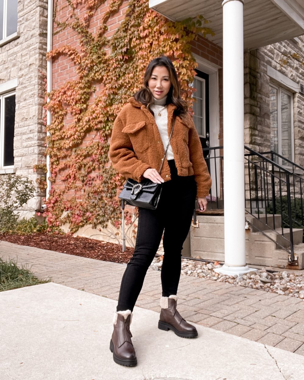 Casual fall/winter outfit with teddy coat, black jeans and brown ankle boots with shearling trim. Styled by Eileen Lazazzera of yesmissy.com