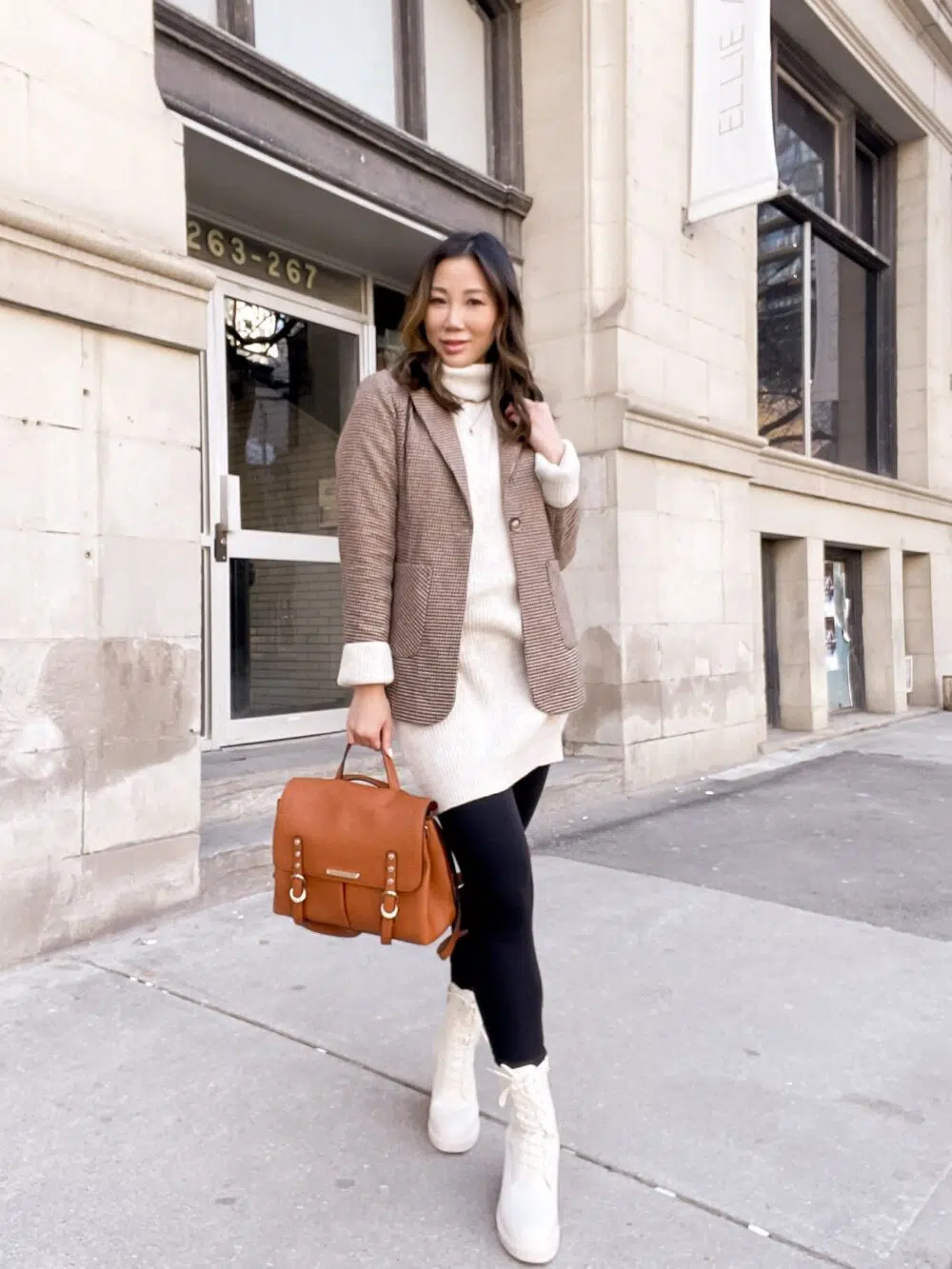 Casual outfit with checkered brown blazer, sweater dress, and cream combat boots. Fall outfit styled by Eileen Lazazzera of yesmissy.com