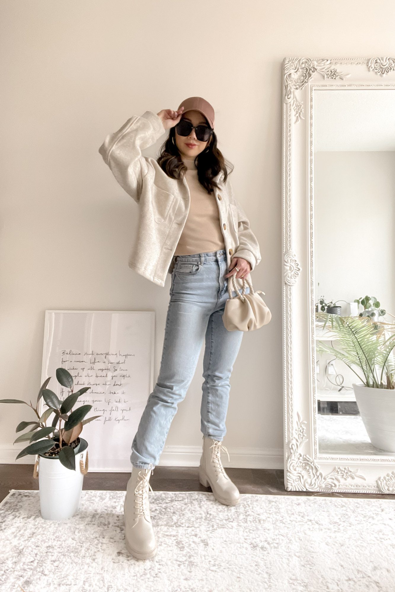 Casual Outfit for everyday and running errands. Mom jeans with shacket and mock neck tank, accessories with baseball cap, oversized sunglasses and cream combat boots. 