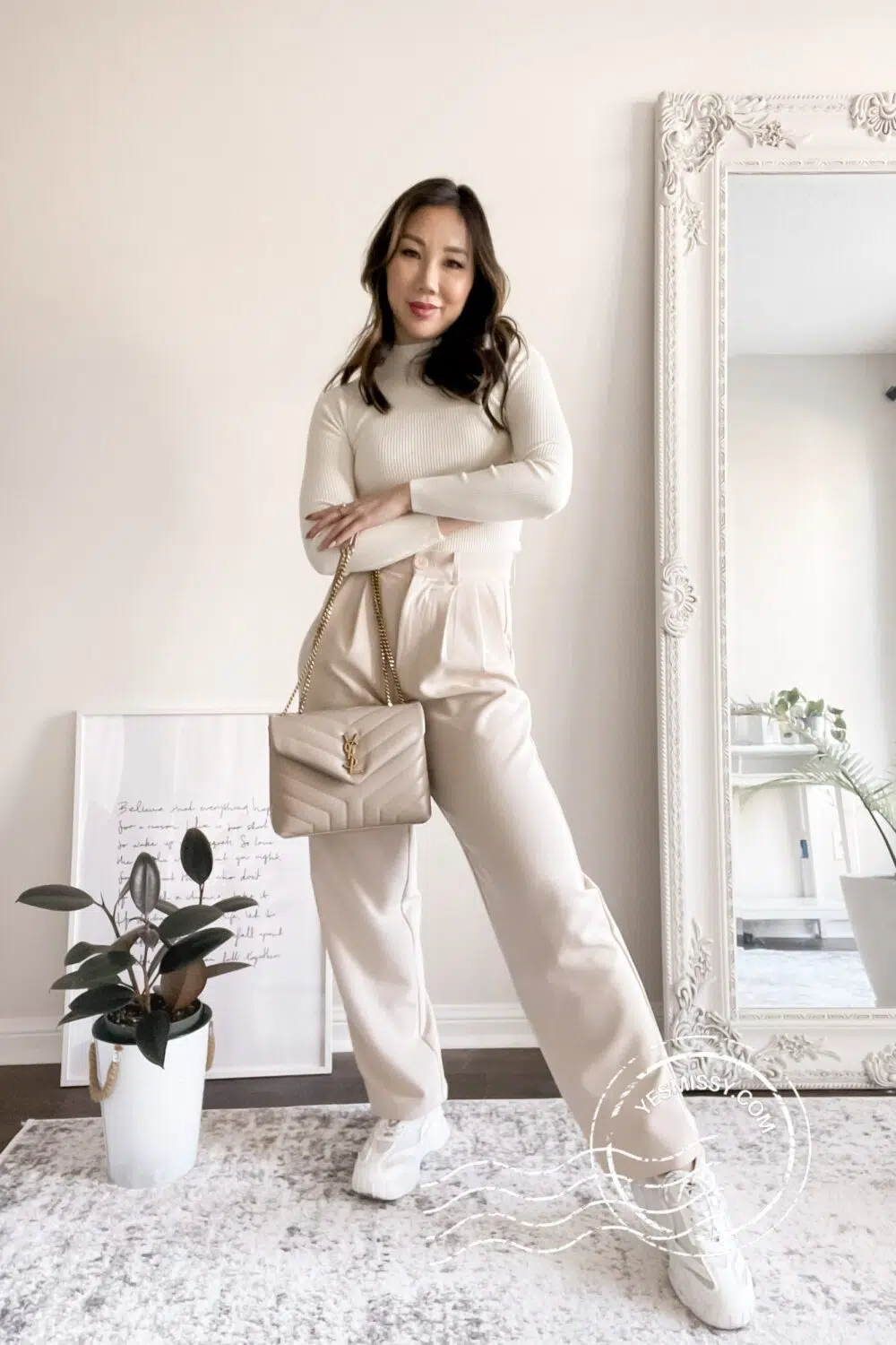 Casual fit with wide leg trouser pants, chunky sneaker, mock neck sweater, YSL Loulou bag. More daily outfit ideas, workwear looks, and weekend outfits on yesmissy.com