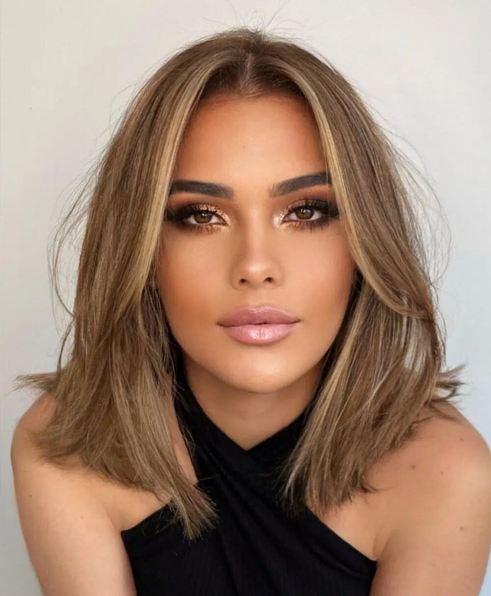Long layered bob with long bangs and balayage highlights