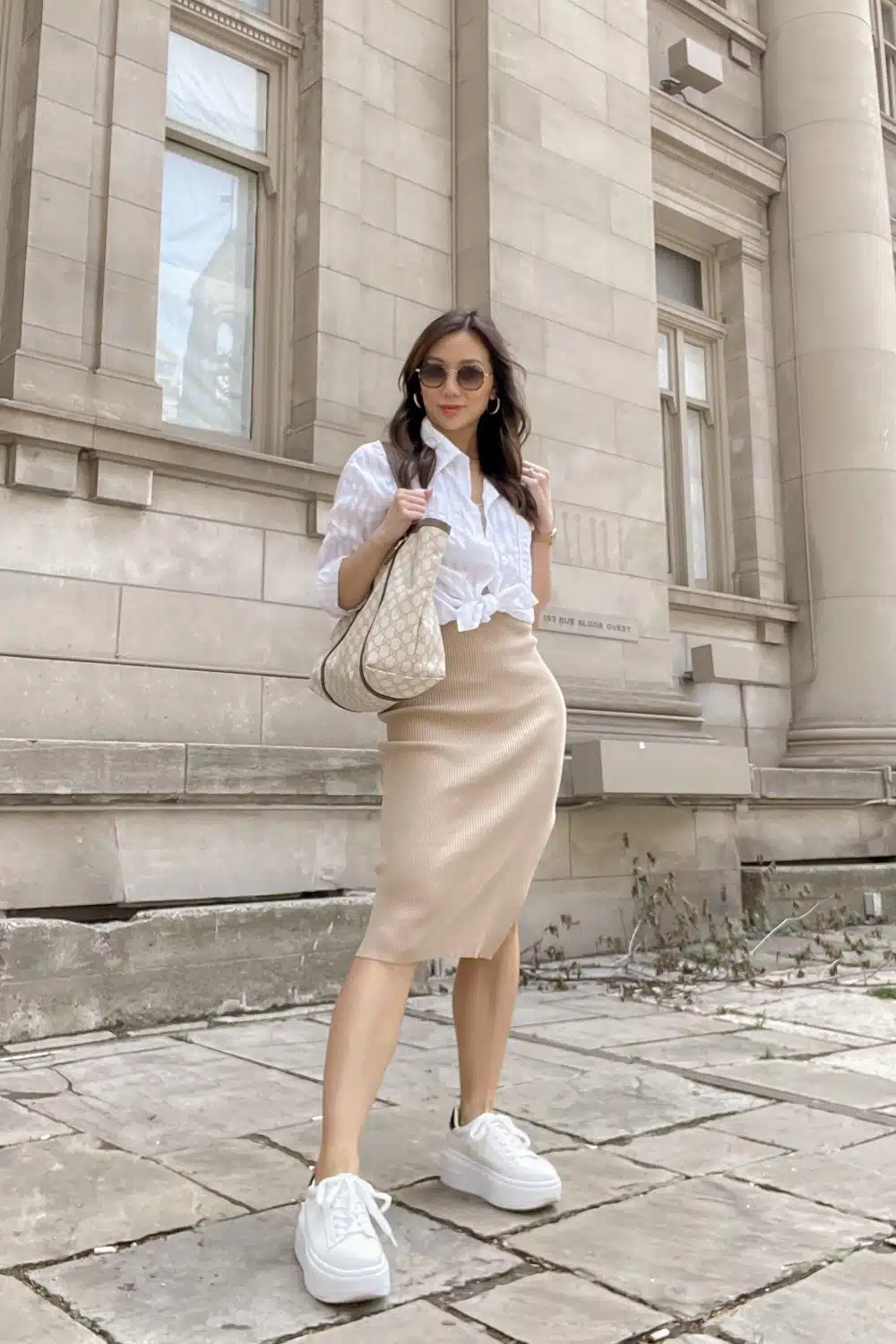 Best Summer Basics for Women - A white button down shirt and neutral pencil skirt with sneakers. Learn to create your own capsule wardrobe for summer