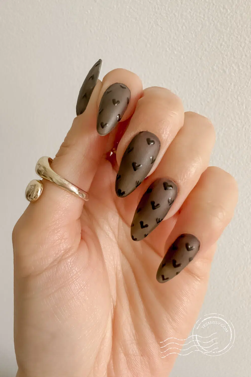 Sometimes the simplest designs are the most stunning. These Valentine's Day nail designs with black hearts hearts will take your breath away.