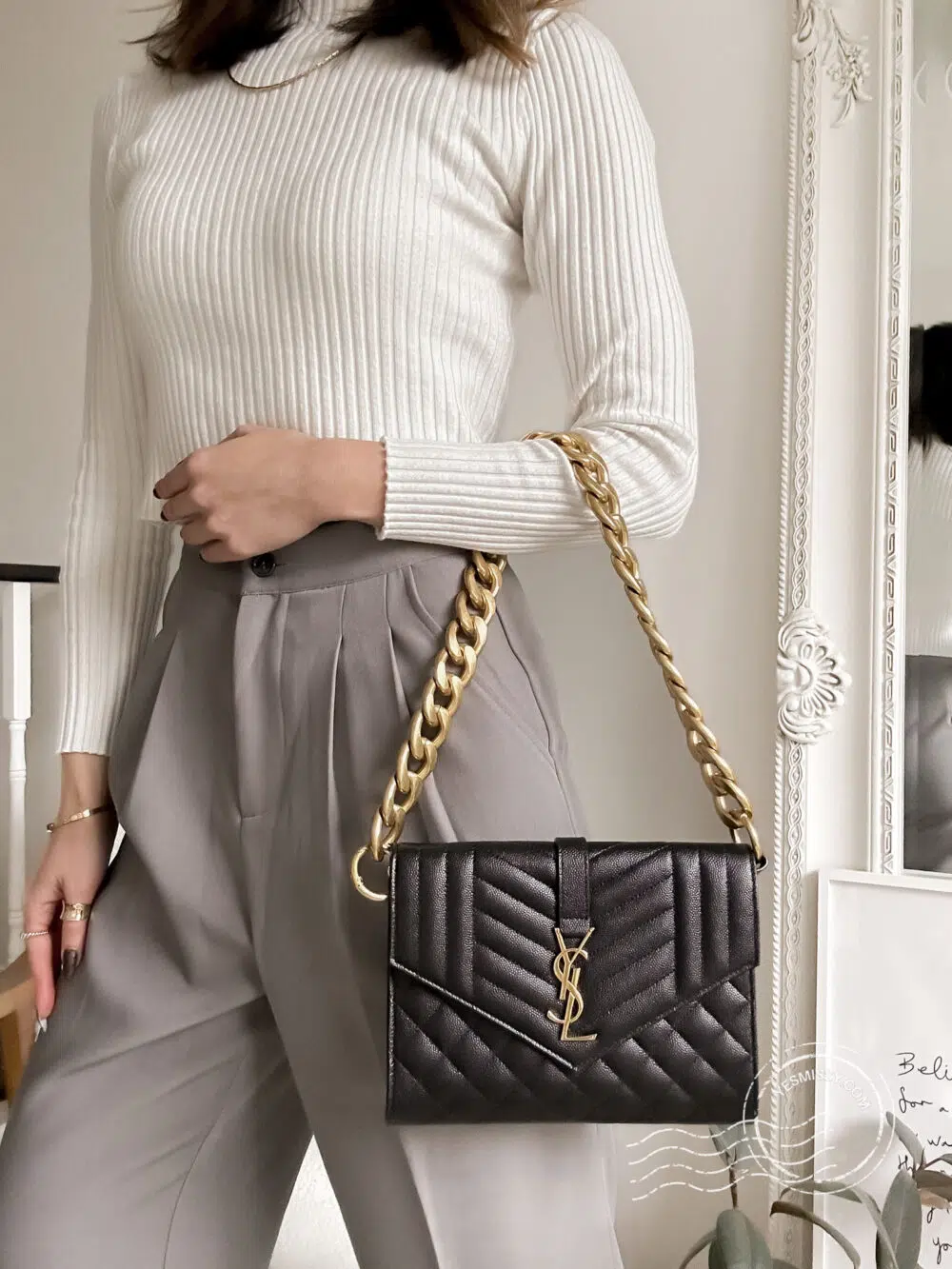 Best back hack: convert your envelope clutch and wallet into a shoulder bag with this chunky gold chain.
