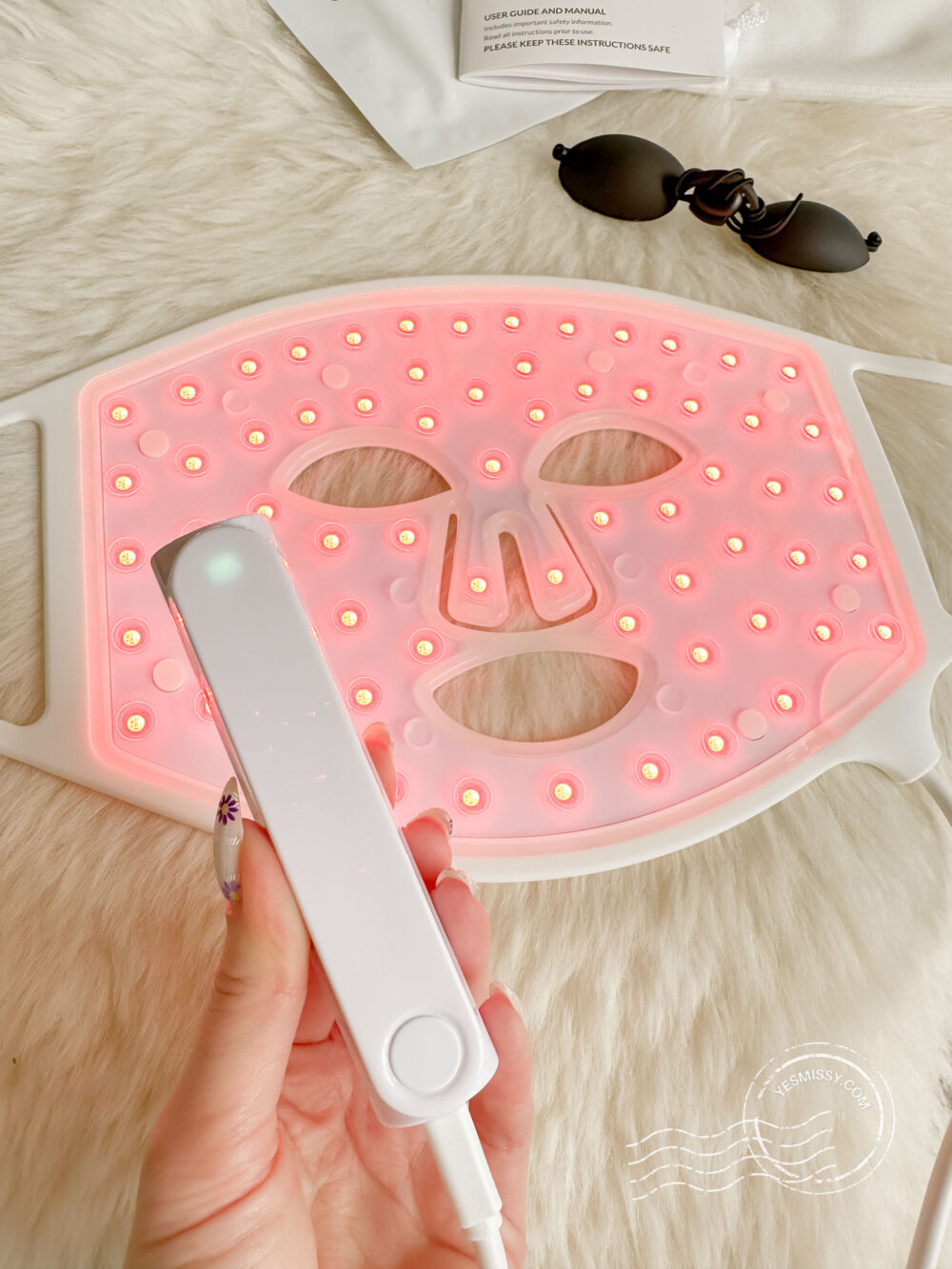  CurrentBody Skin LED Light Therapy Mask with lights on 