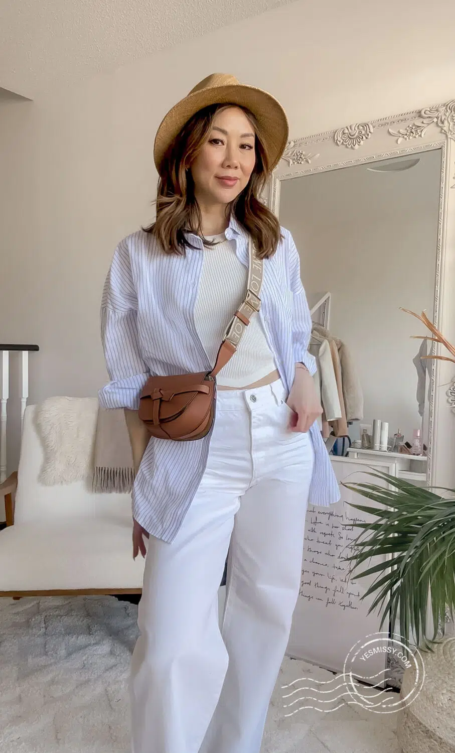 weekend outfit with white wide leg jeans with cropped tank and button down shirt with Loewe bag. More outfit ideas on yesmissy.com