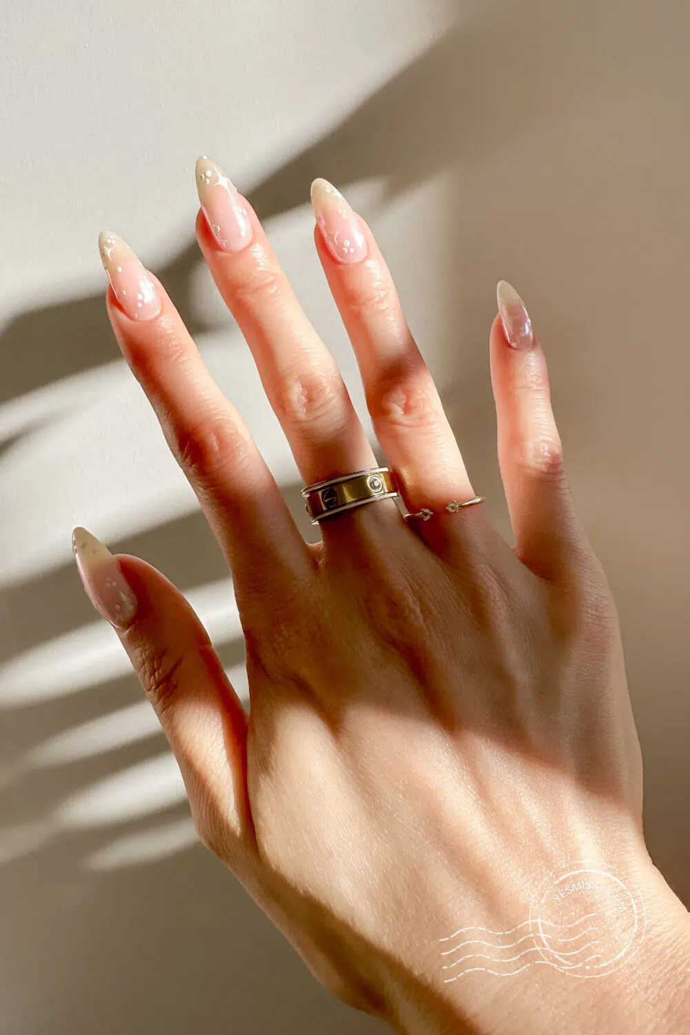 A neutral glazed donut base with subtle star accents—chic, dreamy, and ideal for those who love a romantic twist. More nail inspo on yesmissy.com
