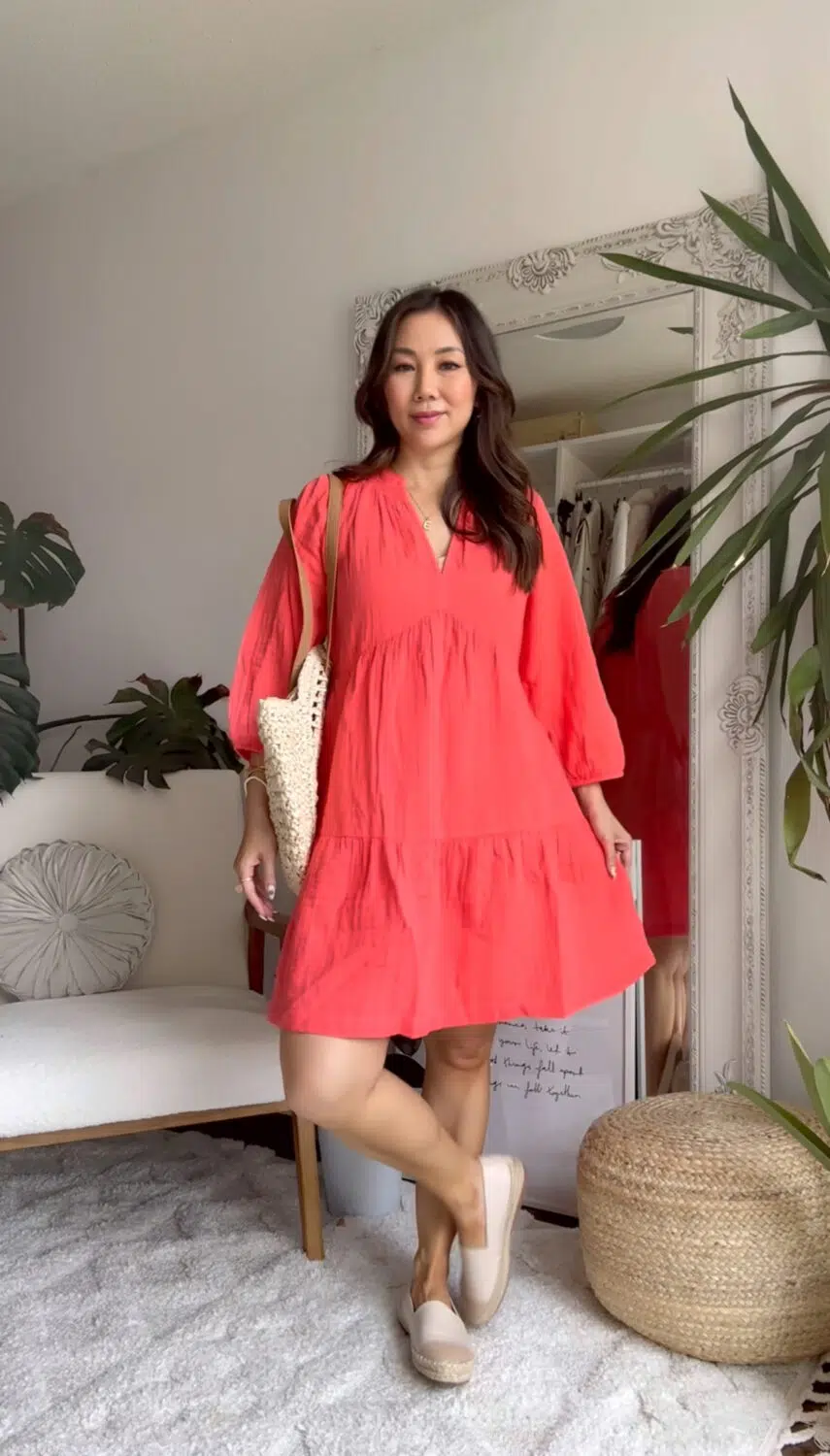 Wardrobe Staples- ummer-ready in a flowy red dress, styled with a crochet bag for a relaxed and chic beach look