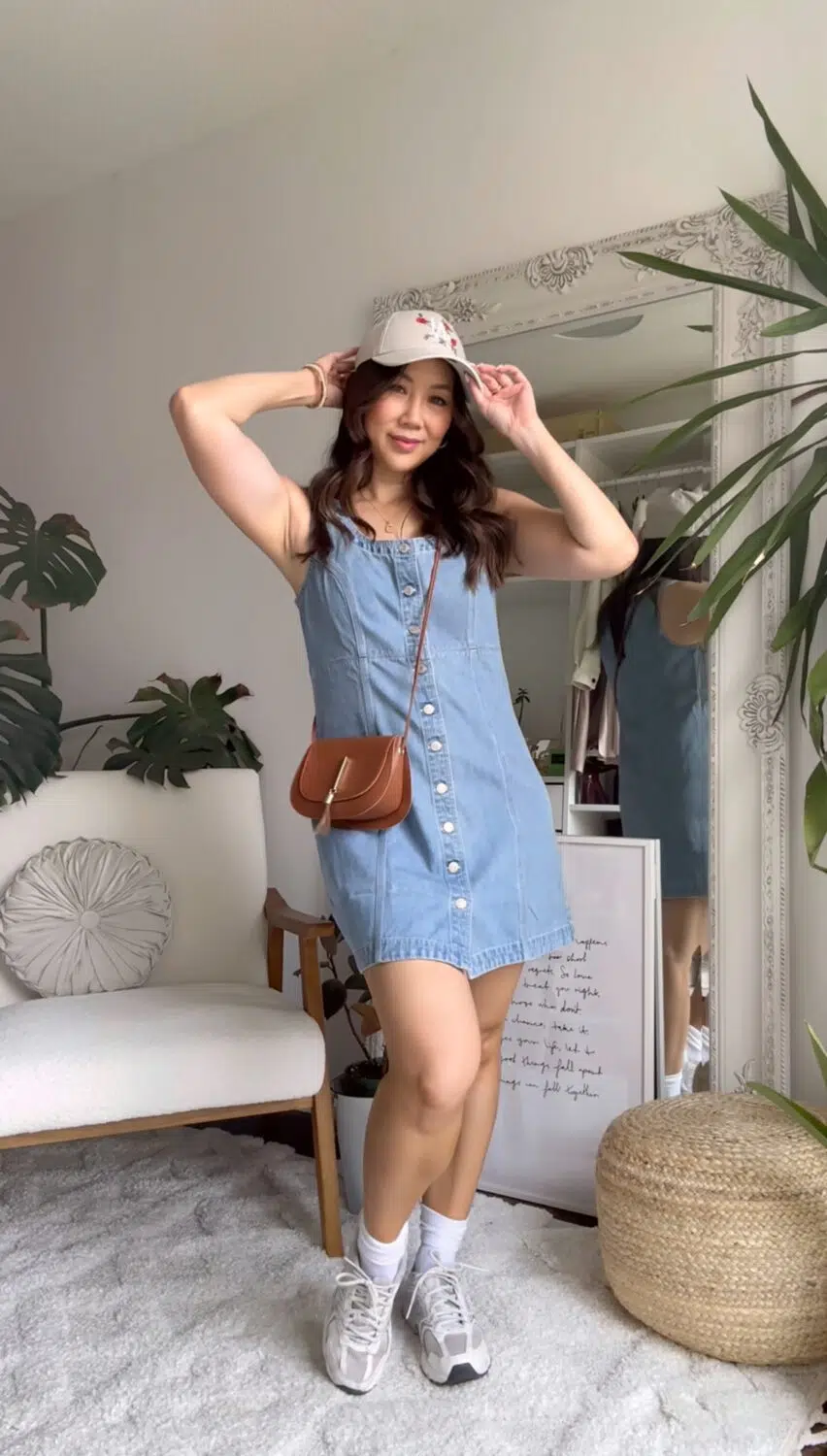 mom outfit ideas - denim mini dress from Gap with sneakers and baseball cap