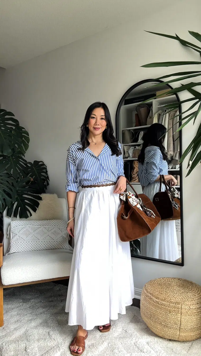 Classy OOTD - quiet luxury look with striped button down and white maxi skirt with suede bag styled by YESMISSY