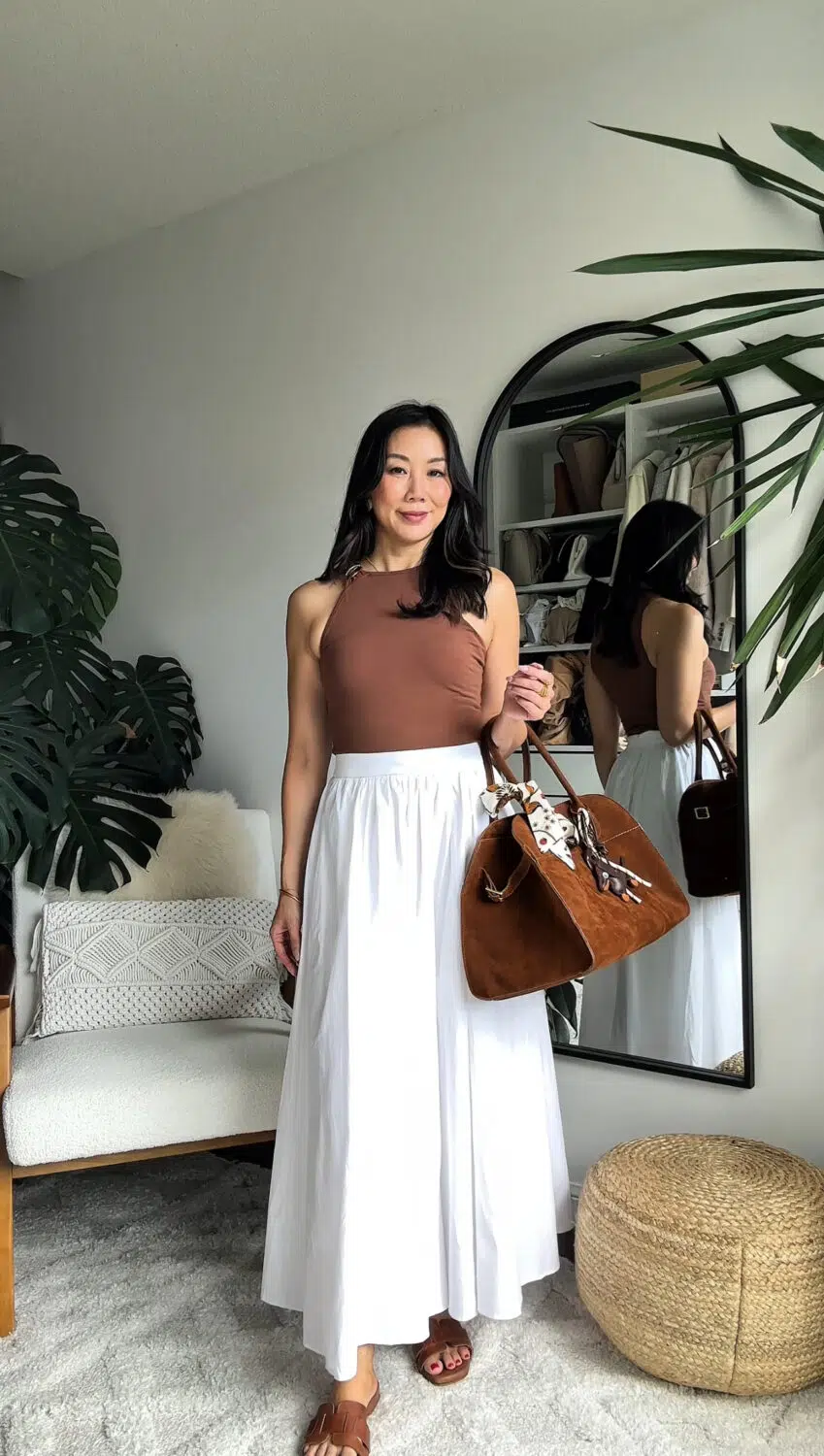 Chic fitted brown tank and white maxi skirt with suede bag and sandals. 