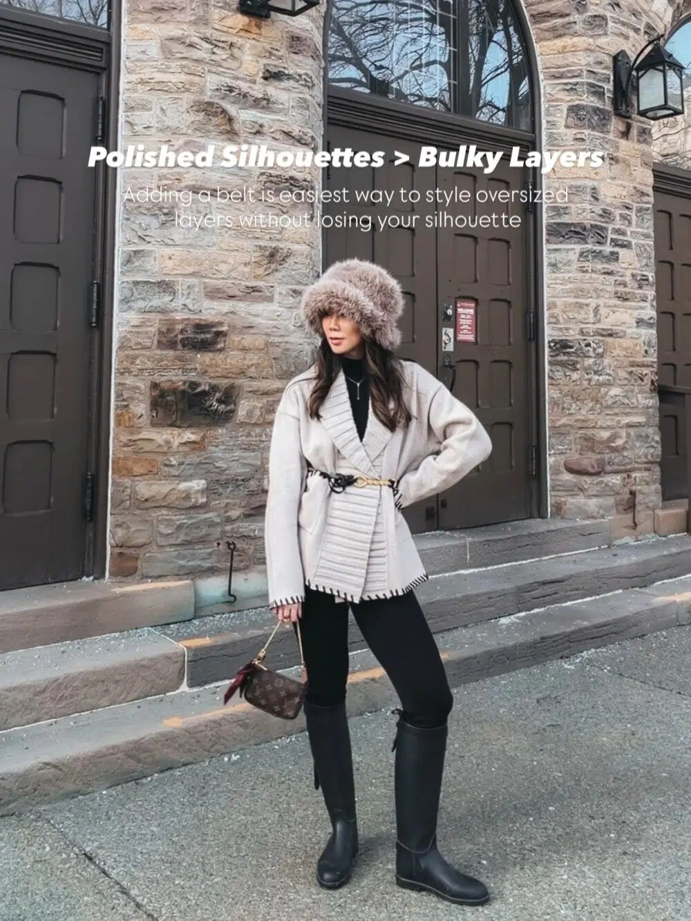 Best Luxury Handbag wearing an elevated winter outfit with a faux fur coat layered over simple neutral basics, creating an effortlessly chic and expensive-looking city winter style.